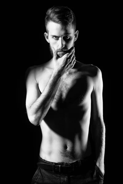 Slim bearded man with thin bare torso isolated on black — Stock Photo, Image