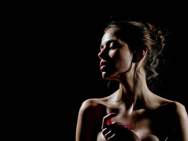 Girl with oily or wet skin on black background — Stock Photo, Image