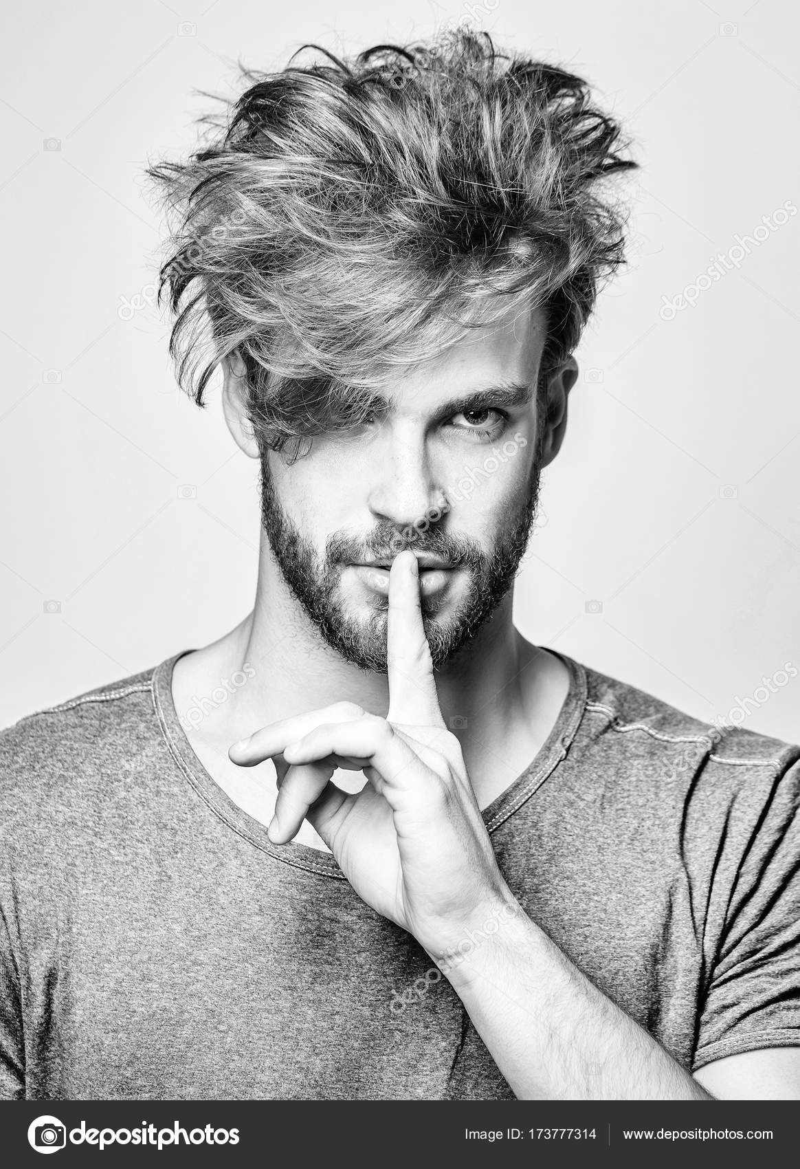 Handsome man makes hush gesture Stock Photo by © 173777314 Handsome man makes hush gesture Stock Photo by © 173777314