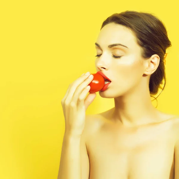 Pretty girl with red tomato — Stock Photo, Image
