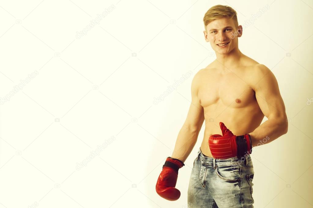 Happy man, boxer showing thumbs up with red, boxing gloves