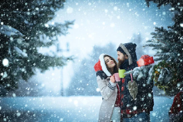 New year girl and guy in snowy forest. — Stock Photo, Image