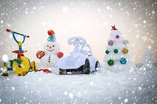 Snowman and snow xmas tree on white sky — Stock Photo, Image