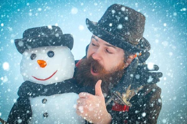 Snowman with smiley face in gloves