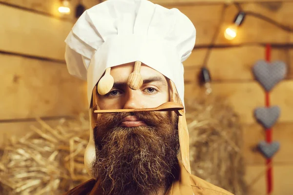 Chef cook with wooden spoons — Stock Photo, Image