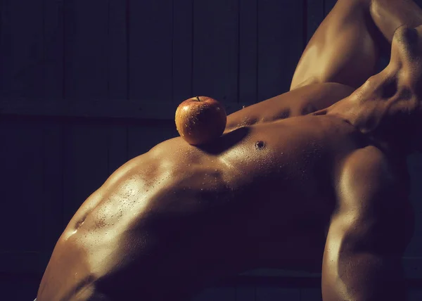 Apple on male torso
