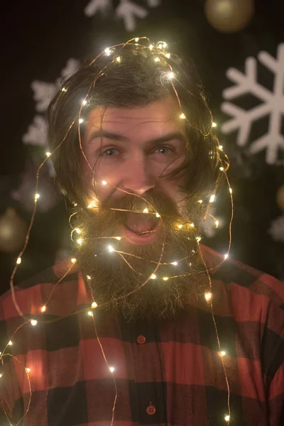 Garland on santa claus man as decoration. — Stock Photo, Image