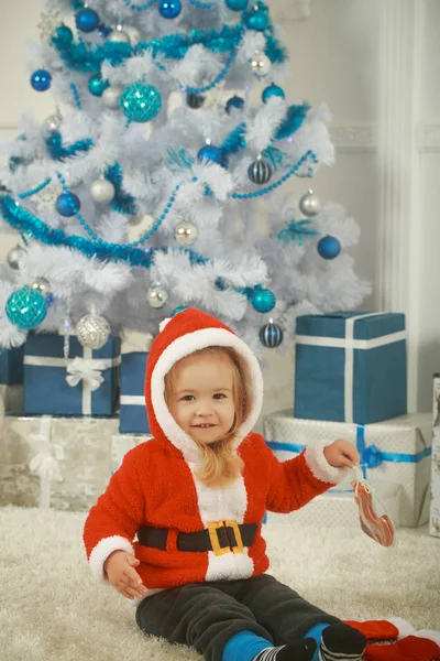 Santa claus kid with present box, black Friday.