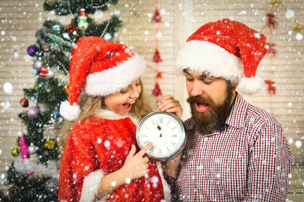 Christmas happy family of child, man father with clock — Stock Photo, Image