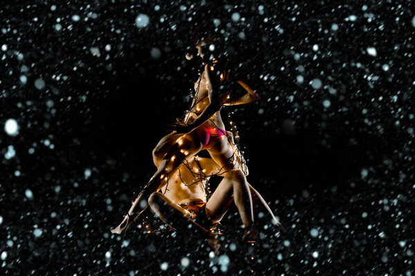 New year boyfriend and girlfriend isolated on black.