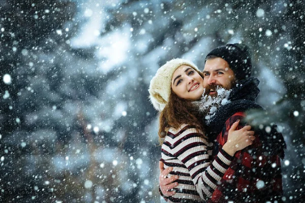 New year girl and guy in snowy forest. — Stock Photo, Image