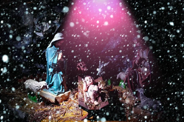 Christmas, Infant Jesus lying in manger in rays of divine light