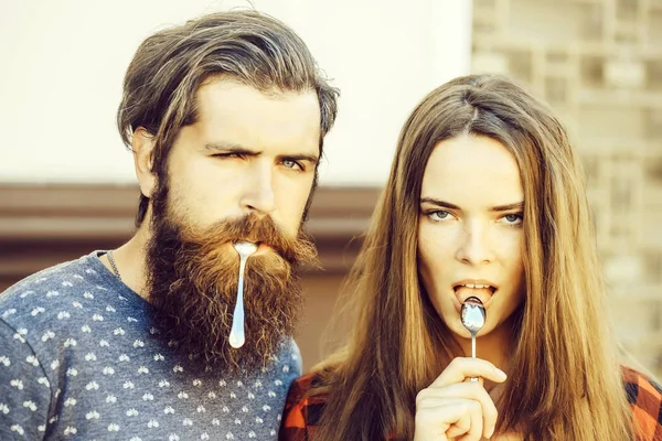 Young couple with tea spoon — Stock Photo, Image