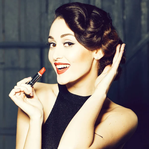Young retro woman with lipgloss