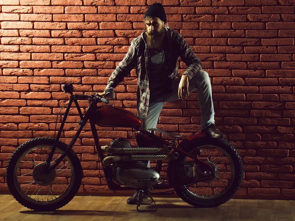 Bearded biker man on motorbike — Stock Photo, Image