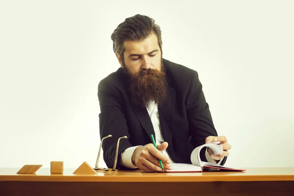 bearded man teacher at table