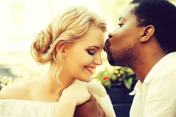 Handsome man kisses pretty girl — Stock Photo, Image