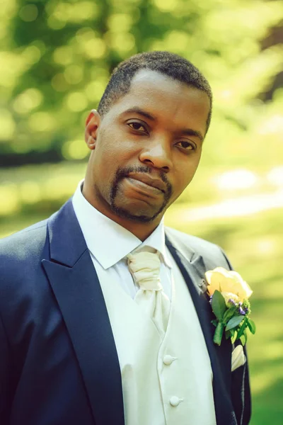 Handsome bearded man or african American groom