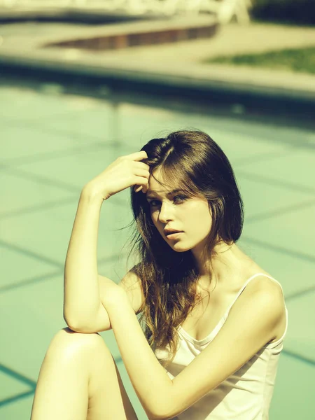 Pretty woman near swimming pool — Stock Photo, Image