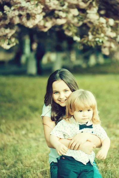 Happy children in orchard — Stock Photo, Image