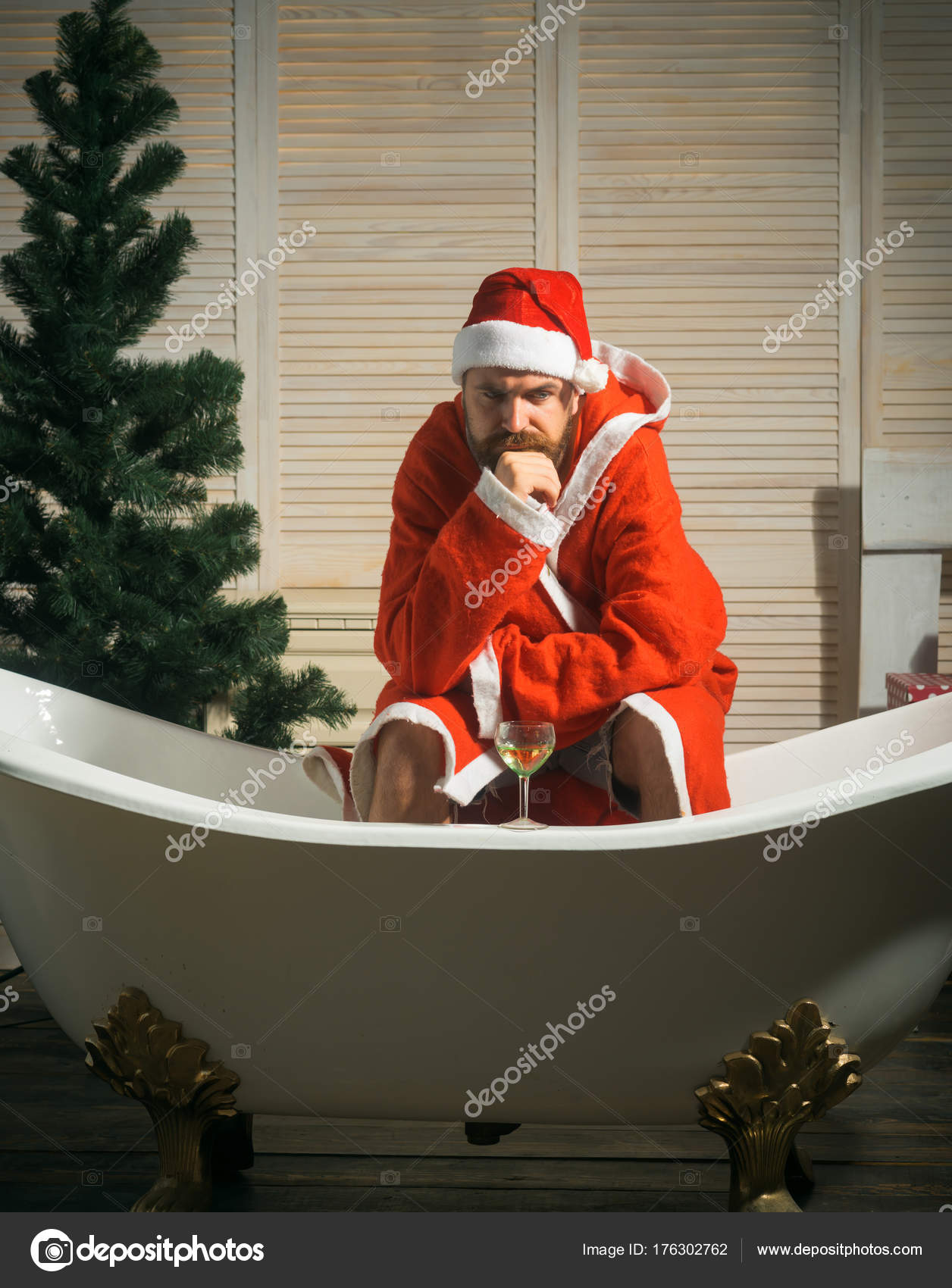 Hipster Santa At Christmas Tree Drink Wine Loneliness Stock Photo Hipster Santa At Christmas Tree Drink Wine Loneliness Stock Photo