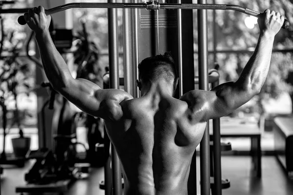 muscular man training in gym