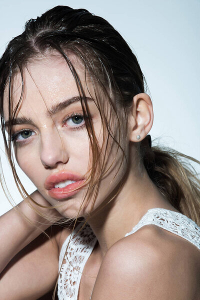 Shampoo and lotion on face of girl.