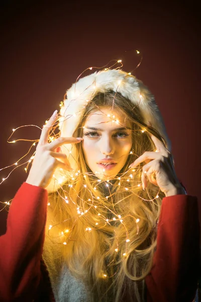 Santa girl in garland at new year party, christmas — Stock Photo, Image