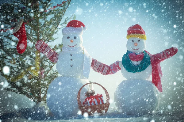 New year snowman from snow in hat. — Stock Photo, Image