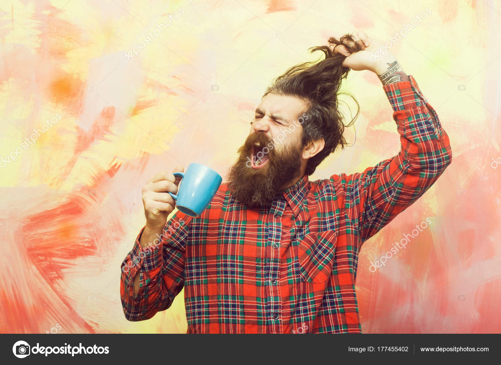 Crying Bearded Man Pulling Stylish Fringe Hair With Blue Cup