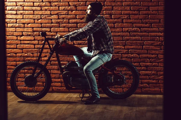 Bearded biker man on motorbike — Stock Photo, Image