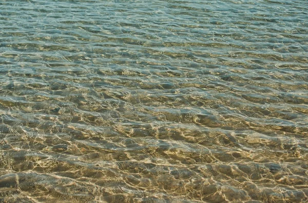 Wateroppervlak van zee of Oceaan glans op zonnige dag — Stockfoto