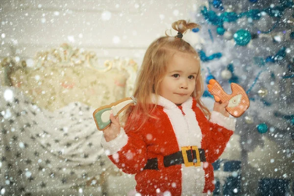 New year small boy at Christmas tree.