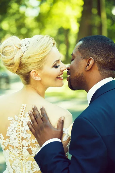 Loving groom touches shoulder of adorable bride — Stock Photo, Image