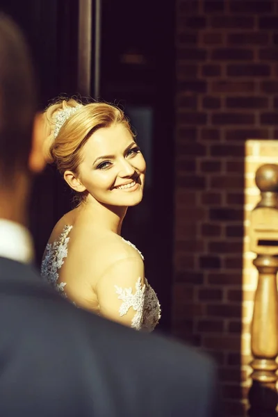 Happy pretty girl or cute bride smiling to groom — Stock Photo, Image