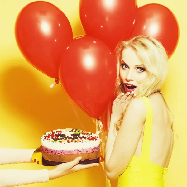 Happy woman with cake