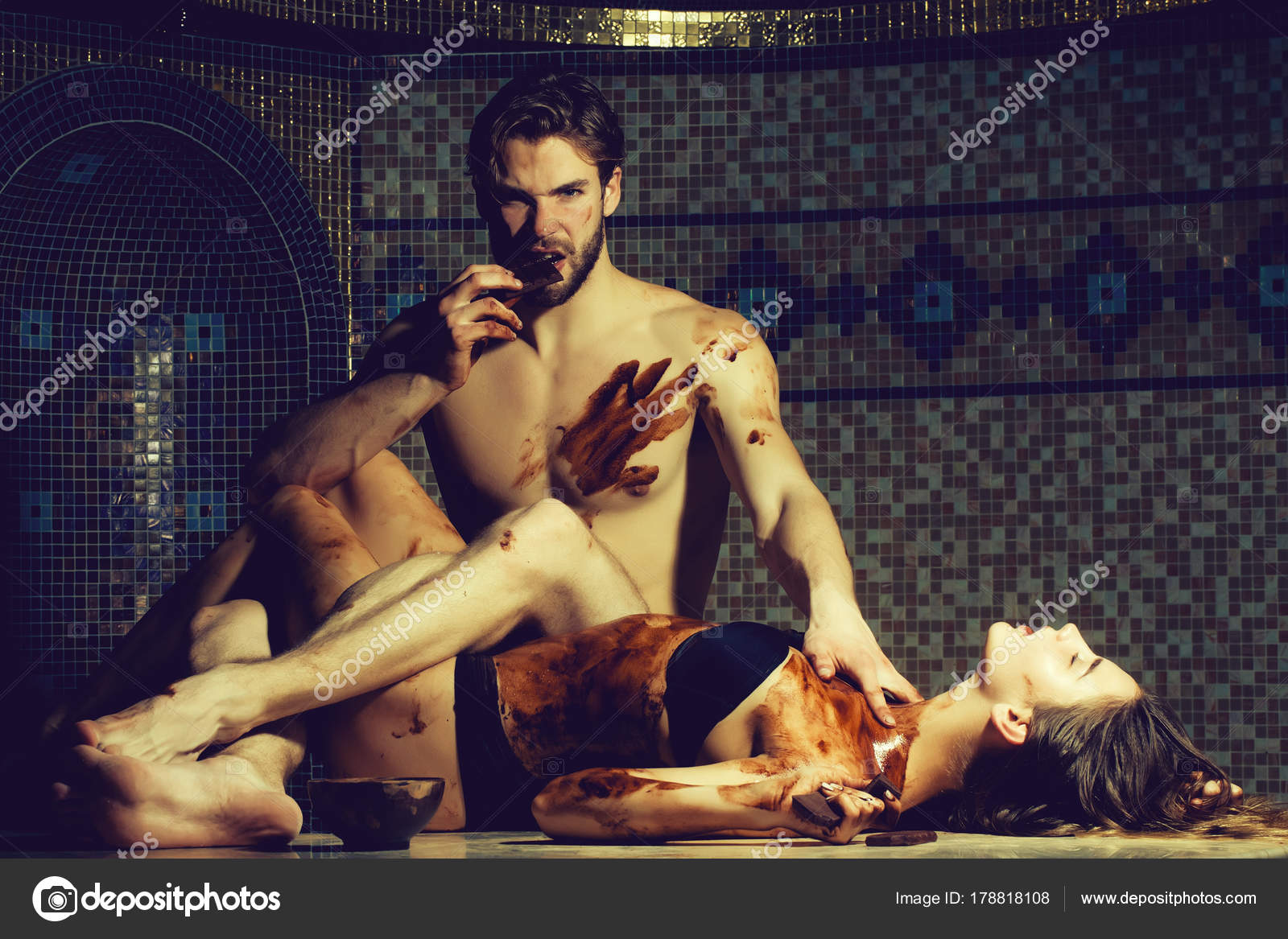 Pretty Woman Or Girl In Erotic Lingerie With Sexy Dirty Body And Handsome Bearded Aggressive Man With Muscular Torso Eat Chocolate Bar After Massage In Pretty Woman Or Girl In Erotic Lingerie With Sexy Dirty Body And Handsome Bearded Aggressive Man With Muscular Torso Eat Chocolate Bar After Massage In