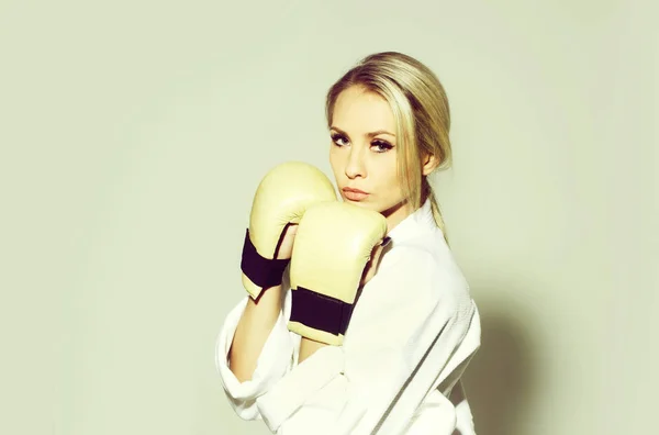 Pretty sexy girl boxer wearing boxing gloves