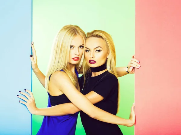 Pretty girls in colorful studio — Stock Photo, Image