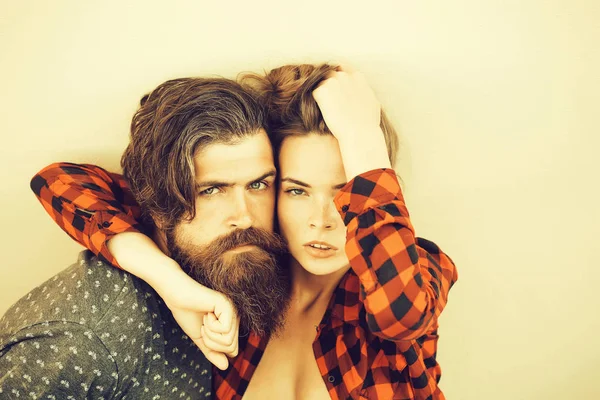 Young couple outdoor on grey background