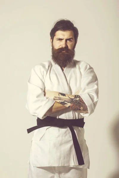 Bearded karate man, brutal caucasian serious hipster in kimono — Stock Photo, Image