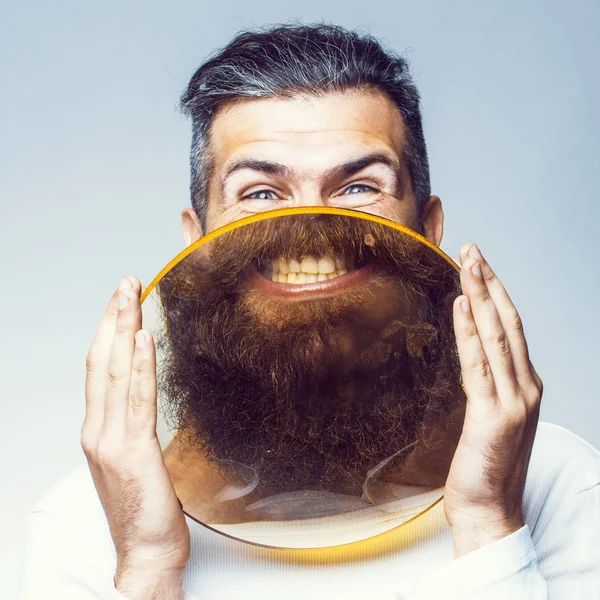 Bearded man with magnifying glass — Stock Photo, Image
