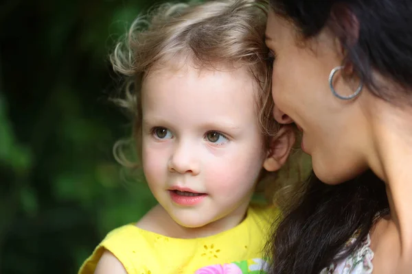 Woman hold girl kid on summer day — Stock Photo, Image