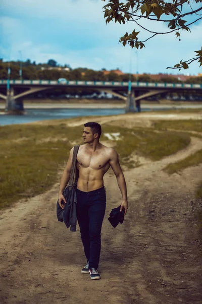 Sexy muscular man with bag — Stock Photo, Image