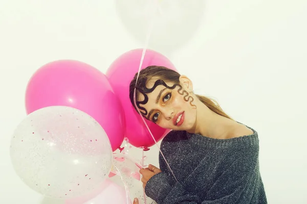 Pretty girl with party balloons