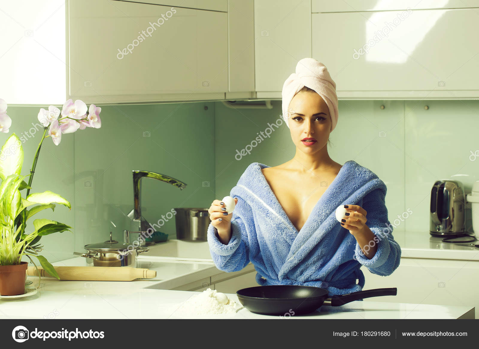 One Sexual Beautiful Sensual Female Housewife Blue Terry Dressing Gown Stock Photo by ©Tverdohlib 180291680
