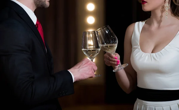 Stock image clink glasses with white wine of couple at meeting