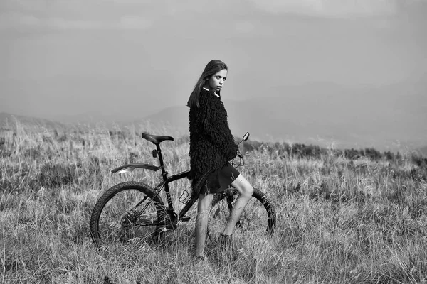 girl with bike on mountain