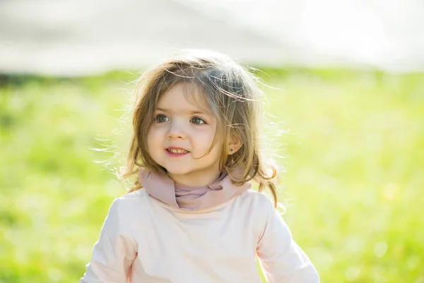 Kid model with long healthy hair on sunny day — Stock Photo, Image