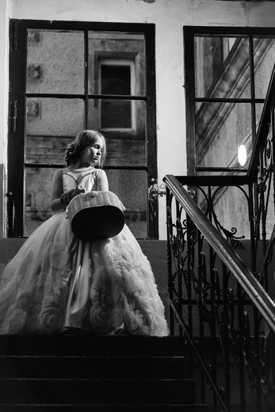 Small girl in white dress near big window — Stock Photo, Image